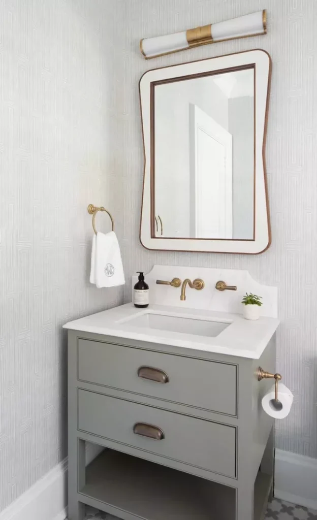 Single Vanity With a Toilet Paper Holder 